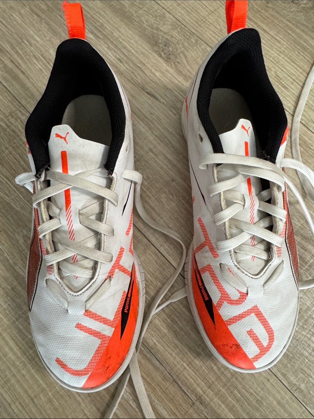 Puma Kids White Sneakers with Orange and Black Accents